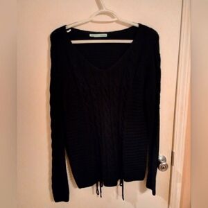 Maurice's black sweater